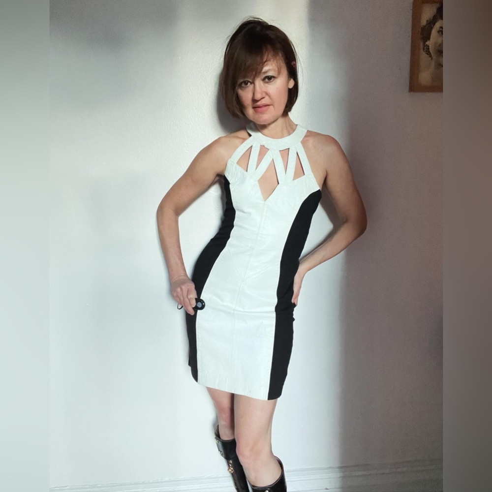 Available Wilson's white leather and black Lycra mini dress. Size S